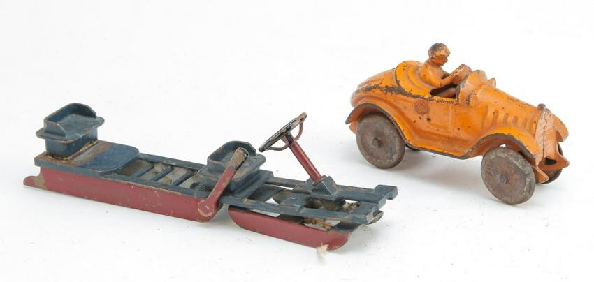 CAST IRON RACE CAR AND PAINTED BRASS TOY SLED