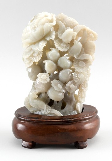 CHINESE WHITE JADE CARVING Depicts flowers, fruits and birds. Height 8". With wood base.