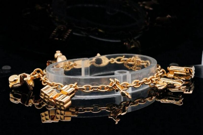 Cartier 1994 18K Yellow Gold 7" 7-Charm Bracelet