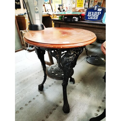 Cast iron and mahogany top pub table {69 cm H x 59 cm Dia.}.