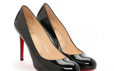 Christian Louboutin: A pair of stilettos made of black patent leather with a thin heel and red soles. Size 40 ½. Heel height approx. 10 cm. (2)