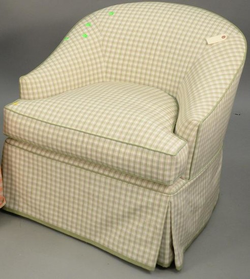 Custom upholstered club chair with upholstered ottoman.