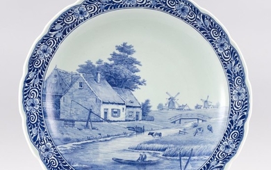 DELFT BLUE AND WHITE WALL CHARGER Depicts boaters and cows along a canal with distant windmills. Signed lower center "J. Sonnaville"...