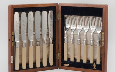 ENGLISH BOXED FORK AND KNIFE SET 6 Knives and forks with bone handles and foliate engraved silverplate blades and tongs by Ellis and...