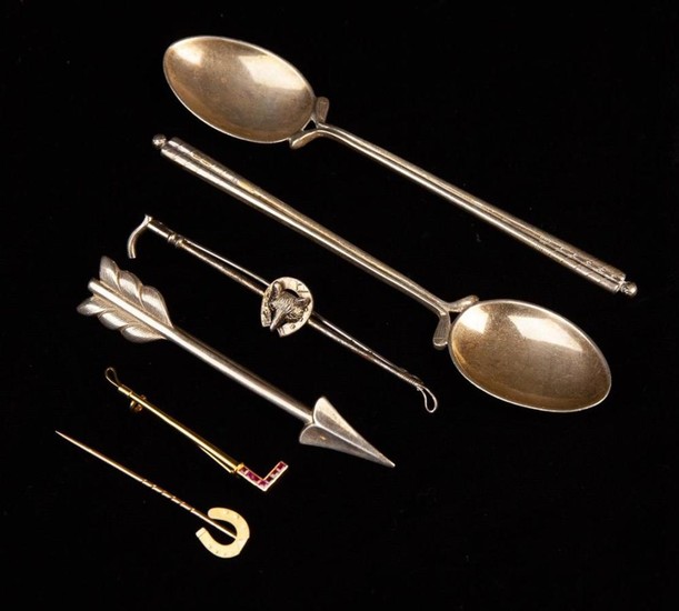 Four Sporting Tie Pins and a pair of Silver Spoons. A 15 carat gold riding crop pin set with seven s