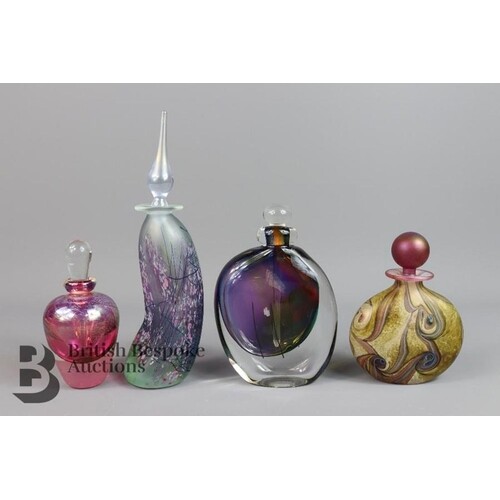 Four glass scent bottles with stoppers, including one Isle o...