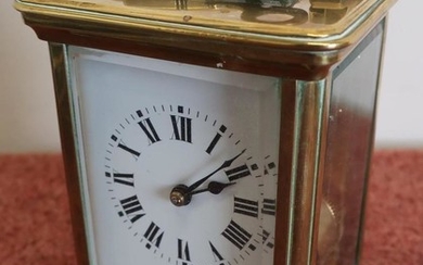 French brass cased striking carriage clock with beveled edged...