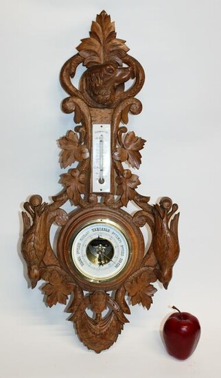 French carved walnut barometer with game