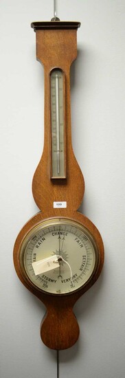 G.H. Rennison, Sunderland: early 20th C oak wheeled barometer.
