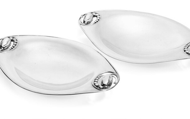 Georg Jensen: “Blossom”. A pair of oval sterling silver bowls, ends with openwork handles. L. resp. 29.8 and 30 cm. (2)