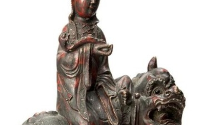 Goddess Guanyin sitting on a Qilin.