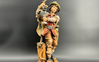 HAND-CARVED WOODEN FIGURE OF A WINEMAKER FROM SOUTH TYROL - FROM THE EGON PIRCHER WOODCARVING WORKSHOP.