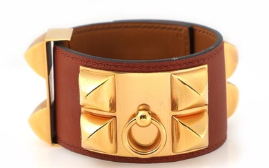 Hermès A “Collier de Chien” bracelet of brown leather and gold coloured...