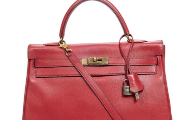 Hermès A “Kelly Retourne 35” bag of red Gulliver leather with gold...