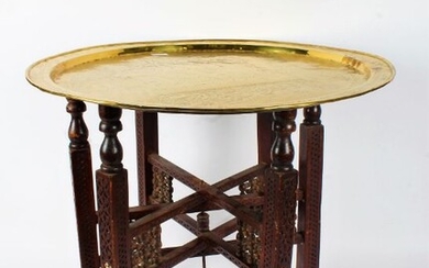 Indian benares brass tray top table, the tray depicting a seated figure with attendants, with