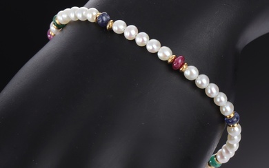 Italian pearl bracelet of 18 kt. gold with sapphires, rubies and emeralds