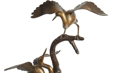 Japanese Patinated and Gilt Bronze Figural Heron Group, 20th c., with out swept wings, perched on