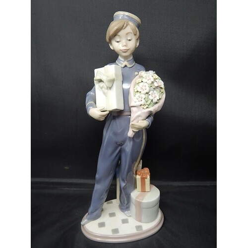 LLADRO Figure of a Bellboy with Chocolates & Flowers: Height...
