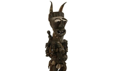 Large African Wood Carved and Bone Figural Group.