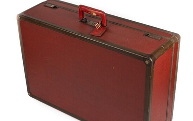 NOT SOLD. Louis Vuitton: A trunk made of burgundy and dark brown synthetic material with short handle made of red leather and gold tone hardware. – Bruun Rasmussen Auctioneers of Fine Art