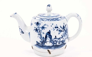 Lowestoft teapot and cover, of barrel shaped with an acorn finial, painted in blue with outsized flowers and rockwork flanking a zig-zag fence, painter's number 8 inside the footrim, 11.5cm high