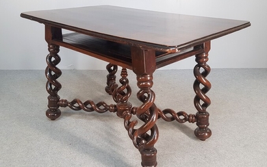 MIDDLE TABLE with a belt top. It rests on a...