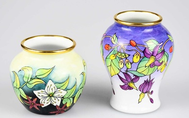MOORCROFT; two enamelled vases, including a bulbous example with white...