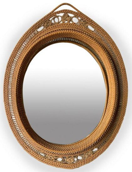 Mirror in woven wicker, Italian production. Years 60.