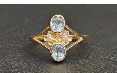 PRETTY BLUE TOPAZ AND SEED PEARL RING each of the oval cut b...