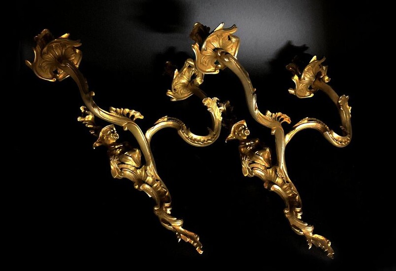 Pair of chased and gilded bronze two-arm sconces Sconces with...