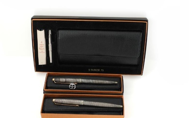 Parker A writing set comprising a fountain pen and two ball pens...