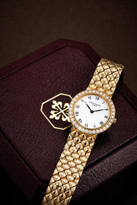 Patek Philippe. A lady's yellow gold and diamond-set bracelet watch