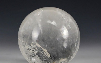 Polished Rock Crystal Sphere, 2.75in. diameter. Natural occlusions Weight 1.25lbs