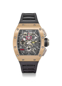 RICHARD MILLE. A VERY RARE AND IMPRESSIVE 18K PINK GOLD AND TITANIUM AUTOMATIC SEMI-SKELETONIZED FLYBACK CHRONOGRAPH WRISTWATCH WITH OVERSIZE DATE, MONTH, 60 MINUTE COUNTOWN, ORIGINAL WARRANTY AND BOX, SIGNED RICHARD MILLE, RM011-FM, REF. RM011 AN...