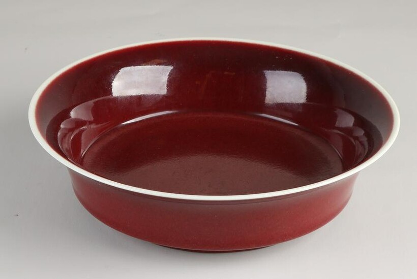 Red glazed Chinese porcelain deep dish. With