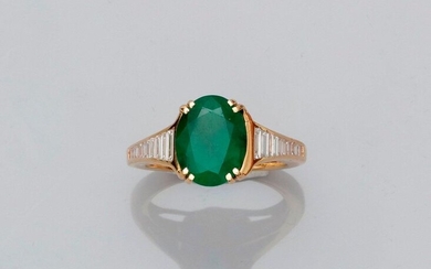 Ring in white gold, 750 MM, set with an oval emerald weighing about 3 carats and set with baguette-cut diamonds, size: 54, weight: 6.15gr. rough.