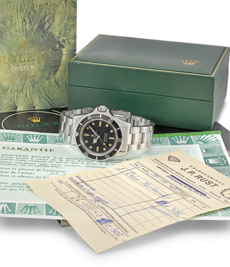 Rolex. A fine stainless steel automatic wristwatch with bracelet, original Guarantee, Sales Invoice and box, SIGNED ROLEX, REF. 5513, OYSTER PERPETUAL, SUBMARINER, 660FT=200M, CASE NO. 7'332'743, CIRCA 1982