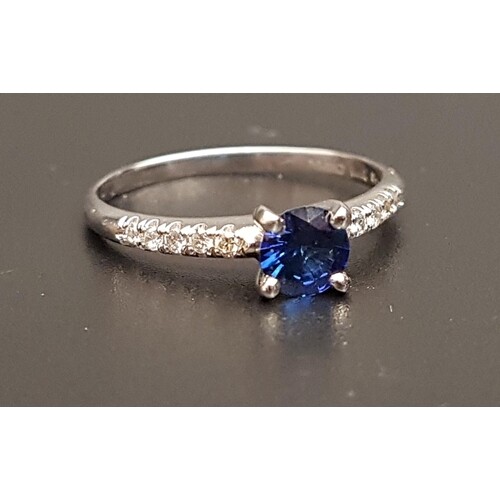 SAPPHIRE AND DIAMOND RING the central round cut sapphire app...