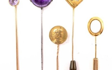SET OF FIVE PINNIPLES IN 18K YELLOW GOLD AND METAL: -one presenting a woman's profile with rose-cut diamonds -one presenting a cabochon opal -one presenting a cabochon amethyst enhanced with nine white pearls (untested) -one presenting a faceted...