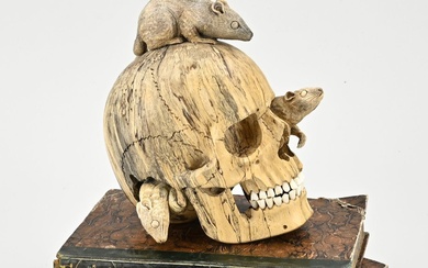 Sculpture. Memento mori wooden skull with finely carved stag horn rats. Plus two books as...