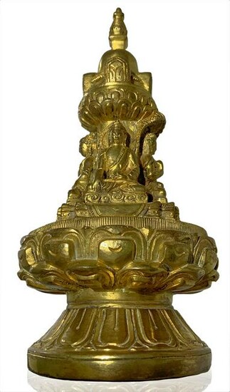 Sculpture in gilted bronze stupa with four small Buddha