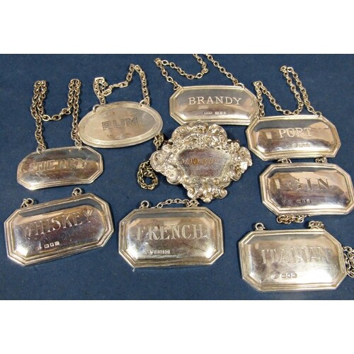 Set of six silver decanter labels of rectangular form with c...