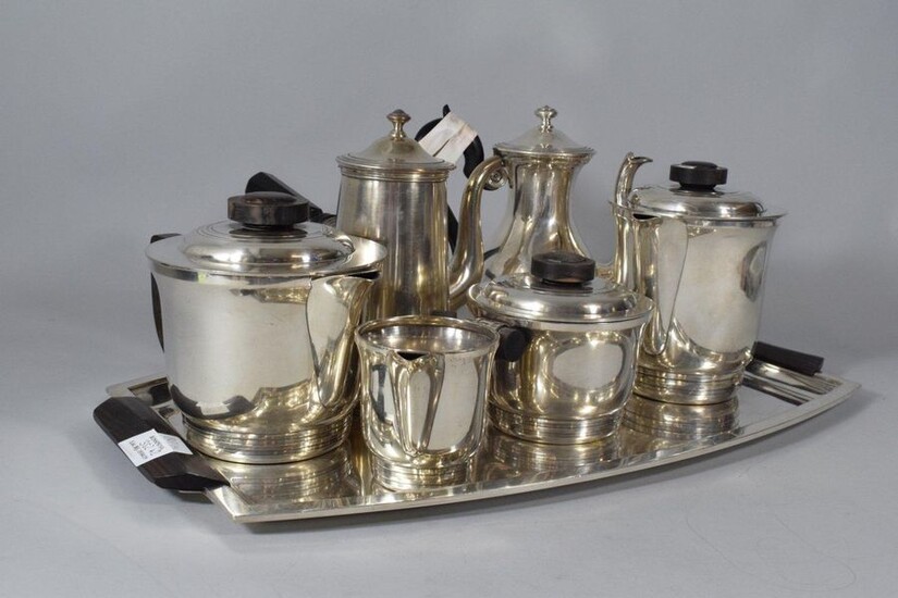 Tea-coffee service in silver plated metal composed of: a tray, a teapot, a coffee pot, a sugar bowl and a milk jug. Decorated with net and rosewood grips.