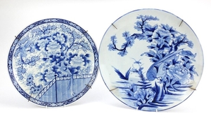 Two Japanese blue and white porcelain chargers, both hand pa...
