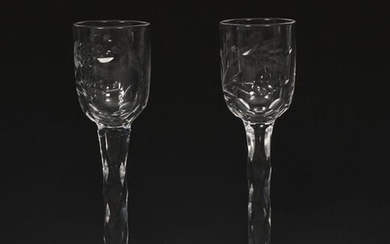 Two rare James Powell & Sons Whitefriars cut glass liqueur glasses, each cut with a stylised flower stem to the bowl, on cut stems unsigned, 14cm. high, (2) Literature Wendy Evans Whitefriars Glass James Powell & Sons of London, Museum of London, page...
