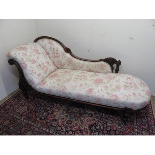 Victorian mahogany chaise lounge, frame well carved with flo...