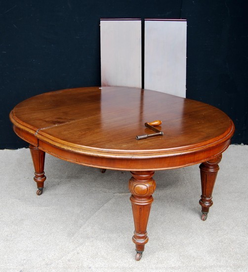 Victorian mahogany extending dining table, the moulded round...