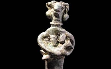 WESTERN ASIATIC BRONZE FIGURE OF A MOTHER WITH CHILD