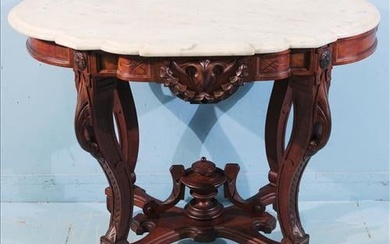 Walnut Victorian marble top center table with carced apron