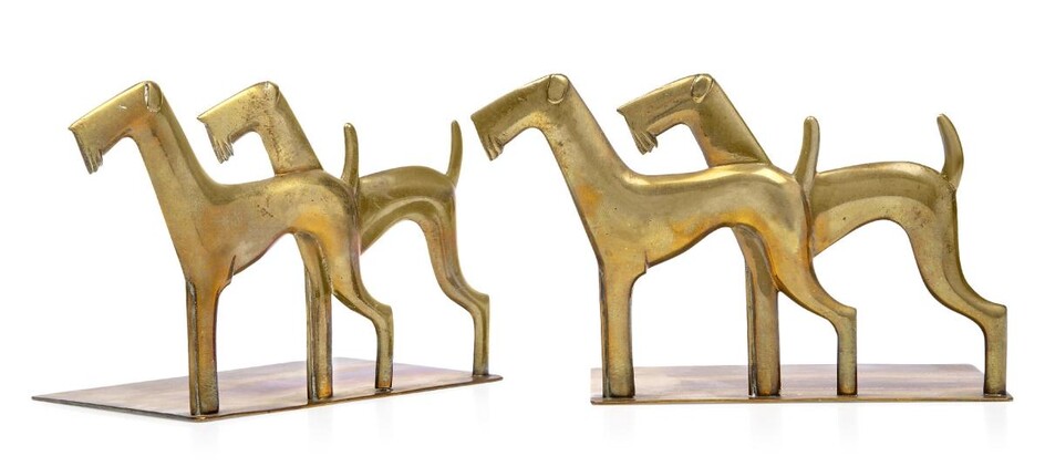 Werkstätte Hagenauer Wien (Austrian), a pair of polished bronze dog bookends, Third quarter 20th Century, with maker’s wHw roundel, Modelled and cast on one side with a pair of stylised ‘Airdales’, plain base, 10.3 cm high, 16.5 cm wide, 8.8 cm...
